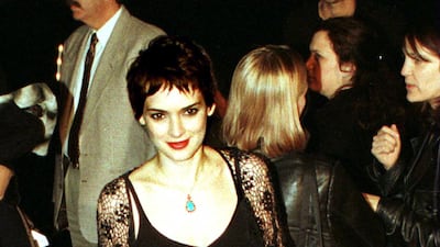 Winona Ryder in black strappy top and leather skirt, enters the premiere of 'Girl, Interrupted' in Hollywood, California, on December 7, 1999. Online USA/Newsmakers
