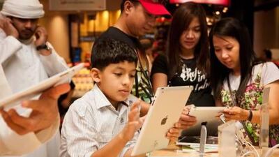 Customers at the Virgin Megastore at Mall of the Emirates in Dubai try out the new iPad, which went on sale officially across the UAE yesterday.