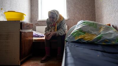 An elderly woman waits do be evacuated from a hospice in Chasiv Yar city, in Donetsk, eastern Ukraine. At least 35 residents have been helped to flee from the region that has been under attack for weeks. AP