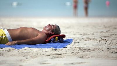 Doctors recommend brief exposure to the sun to overcome vitamin D deficiency, but also advise people to wear sun cream. Silvia Razgova /The National