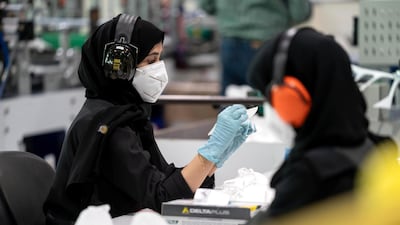 Strata employees at its Al Ain plant. The company equipped staff with the skills needed to manufacture PPE. Courtesy: Ministry of Presidential Affairs.