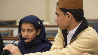 Nabila Rehman (left), 9, and her brother Zubair, 13, who were injured by a US drone strike in Pakistan, attend a press conference on Capitol Hill. Jim Watson / AFP