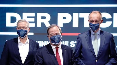 The three candidates for the chairmanship of the CDU, Norbert Roettgen, Armin Laschet, and Friedrich Merz. AP Photo