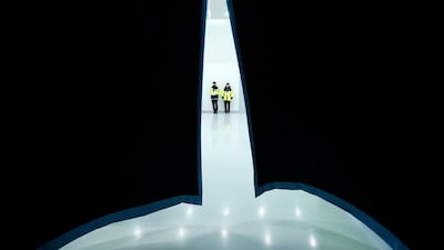 Police stand inside stadium corridor before the start of the men's ice hockey quarter-final matach between the Czech Republic and the US. Brian Snyder / Reuters