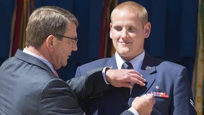 US secretary of defense Ashton Carter (L) awarding US Air Force Airman First Class Spencer Stone (R) the Airman's Medal for his role in disarming a gunman on a Paris-bound train on August 21. EPA