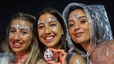 Women pose for photo on New Year's Eve at Copacabana beach in Rio de Janeiro, Brazil. AFP