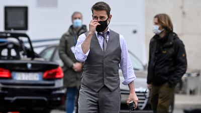 Tom Cruise seen on set wearing a face mask during the shooting of 'Mission: Impossible 7' at Piazza Venezia in Rome, Italy on November 29, 2020. EPA