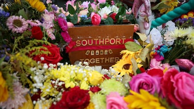 Floral tributes left near the scene of the fatal knife attack on three young girls last July in Southport, Britain. Reuters