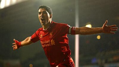 Luis Suarez celebrates his second and the team’s fourth goal on a night of having with the captain’s armband for the first time for Liverpool. Paul Gilham / Getty Images