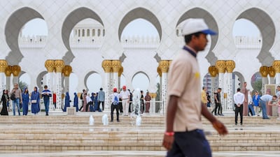 The cold weather didn't stop people visiting Sheikh Zayed Grand Mosque. Victor Besa / The National.