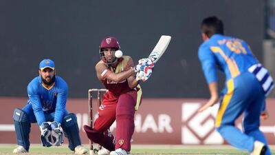 The Kandahar Knights, in red, in action against Nangarhar Leopards in the Afghanistan Premier League in Sharjah on October 6. Chris Whiteoak / The National