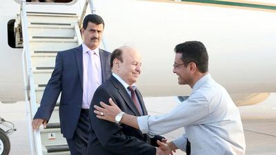 Yemeni president Abdrabu Mansur Hadi is greeted by his representative in Aden, Mohammed Ali Marem upon his return to the southern port city. Photo by Wam
