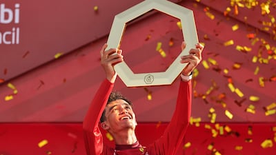 Race winner and UAE Team Emirates rider Isaac del Toro celebrates on the podium after the seventh and final stage of the UAE Tour from Zayed National Museum to Abu Dhabi Breakwater. AFP
