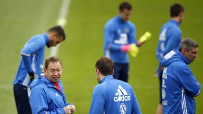 Russia coach Leonid Slutsky, left, put his players through a training session in Lille. Yoan Valat / EPA