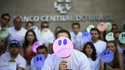 People who have been approved in a public contest to hold positions in the Brazilian central bank protest the delay in their hiring on January 21. Ueslei Marcelino / Reuters