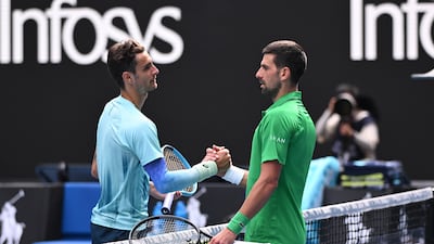 Lorenzo Musetti, left, of Italy retired injured during his Australian Open quarter-final against Novak Djokovic at Melbourne Park. EPA