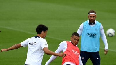 Marquinhos fights for the ball with Kylian Mbappe during training in Paris. AFP
