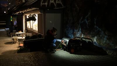 In Kyiv, an electrical generator is used to provide power to a cafe after electricity was cut on Saturday. Getty