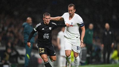 Klemen Sturm of NS Mura is challenged by Harry Kane. Getty