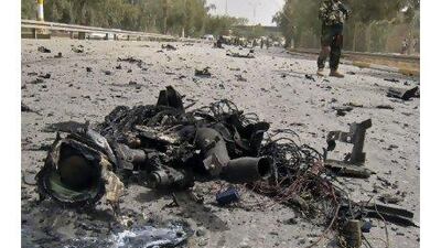 An Iraqi soldier secures the scene of a suicide car bomb in Baghdad on Monday. Few Iraqis expect the capital to host the Arab League summit next month.