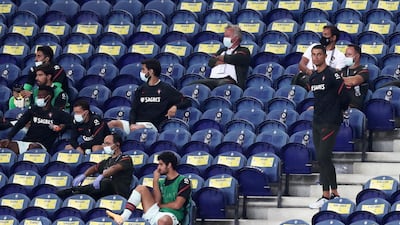 Portugal's Cristiano Ronaldo stands next to the team substitutes on the stands during the UEFA Nations League match between Portugal and Croatia. AP Photo