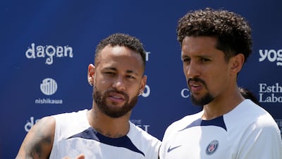 Paris Saint-Germain players, Neymar, left, and Marquinhos, before a group photo taken during a PSG soccer lesson Monday, July 18, 2022, in Tokyo. AP Photo