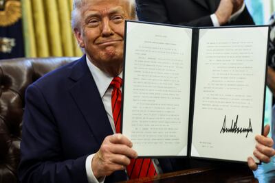 President Donald Trump signs executive orders in the Oval Office at the White House in Washington April 17, 2025. Reuters