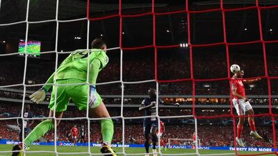 Benfica's Portuguese forward Goncalo Ramos heads the ball moments before PSG's Danilo Pereira scored an own goal to level at 1-1. AFP