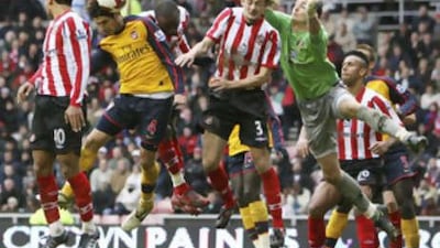 Cesc Fabregas, second left, rises above the Sunderland defence to head home Arsenal's equaliser.