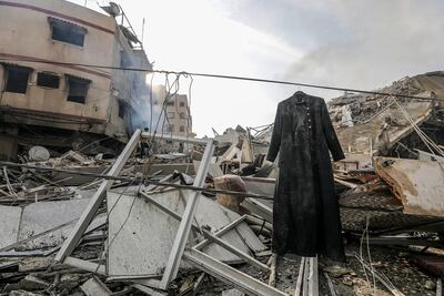 A coat hangs beside the rubble at the site of the destroyed Al-Watan Tower following Israeli air strikes in Gaza City on Sunday. EPA
