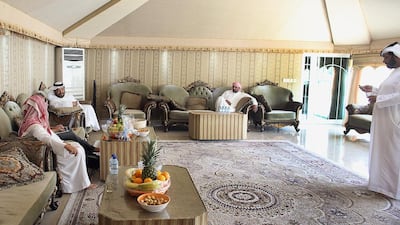 Mubarak Al Qusaili and family, inside their tent. Tent decorum dictates that anyone is welcome at any time, without advance notice. Delores Johnson / The National