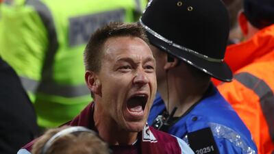 John Terry celebrates at the full-time whistle as a 0-0 draw against Middlesbrough sent Aston Villa through to the Championship play-offs final against Fulham on May 26. Clive Mason / Getty Images