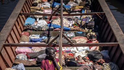 A girl on a boat along the White Nile river in Renk. Aid agencies require funding to provide services such as transport for families travelling to displaced people settlements