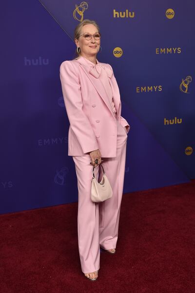 Meryl Streep stands out in a pink suit. AP