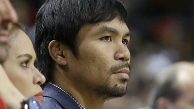 Manny Pacquiao watches the game between the Miami Heat and the Milwaukee Bucks on January 27. 2015. Alan Diaz / AP