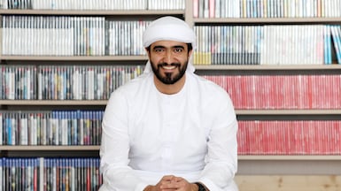 Emirati collector Omar Al Hashmi in his Dubai gaming room, surrounded by part of his 800-game collection. Chris Whiteoak / The National