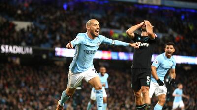 Manchester City midfielder David Silva wheels away after scoring what proved to be the winning goal against West Ham at the Etihad Stadium. Clive Brunskill / Getty Images