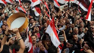 Thousands of Egyptian shout slogans as they gather at Tahrir Square in Cairo on Friday.
