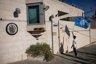 A far-right Israeli activist protests against recently announced sanctions outside the British Consulate in Jerusalem. Getty Images