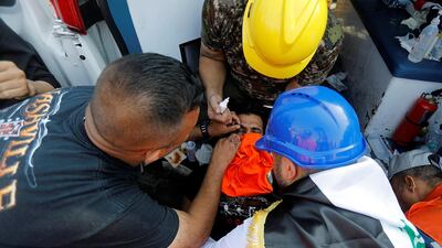 A demonstrator affected by tear gas is treated in Baghdad. Reuters
