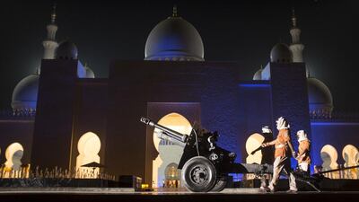 A practice march on Tuesday night in front of the cannon at Sheikh Zayed Grand Mosque in Abu Dhabi, fired each evening of Ramadan to signal the maghrib prayer. Reem Mohammed / The National