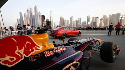 The Infiniti Red Bull Racing, RB7 sits in the garage next to the Infiniti Q50 Eau Rouge during an Infiniti Red Bull Racing show run.