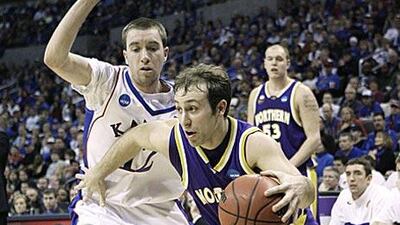 Northern Iowa's Ali Farokhmanesh drives past the Kansas guard Brady Morningstar.
