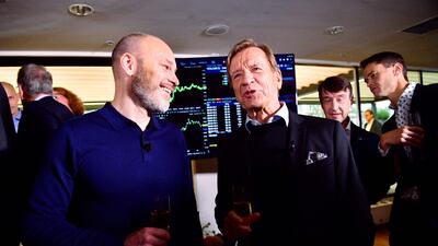 Volvo Cars' CEO Hakan Samuelsson (R) and the company's CFO Björn Annwall (L) celebrate during the official bell-ringing ceremony at the Volvo Showroom in Stockholm as the company was listed on the Nasdaq stock exchange in Stockholm. AFP