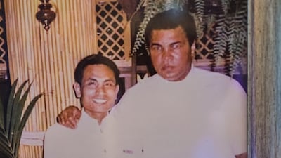A photo hangs on The Fishmarket’s curved wall showing Muhammad Ali at the restaurant in the early 1990s. Victor Besa / the National