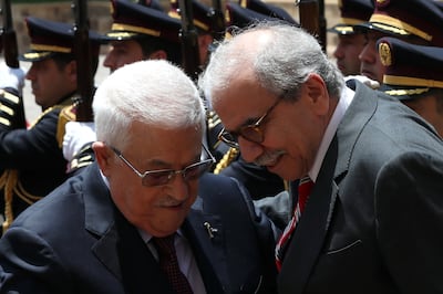 Lebanese Prime Minister Nawaf Salam welcomes Palestinian President Mahmoud Abbas before their meeting at the Government Palace in Beirut. EPA