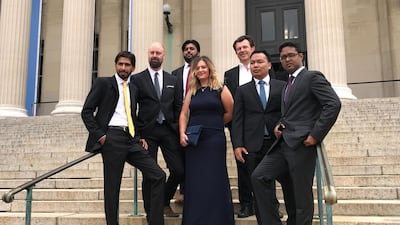 The Reuters Pulitzer Prize winning photography team of (L-R) Adnan Abidi, Cathal McNaughton, Danish Siddiqui, Hannah McKay, Damir Sagolj, Soe Zeya Tun and Mohammad Ponir Hossain pose for a photo. Reuters