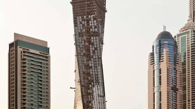 Stand-out: the imposing Infinity Tower spirals its way up in the Dubai Marina.