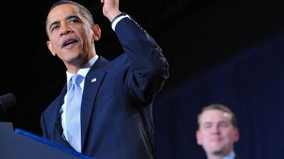 The US president Barack Obama, speaking at a fundraiser for Senator Michael Bennet, right, said that the country is over the worst of the crisis.