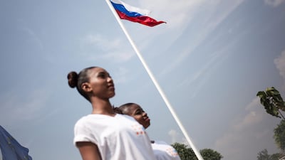 The Russian flag overlooks the Miss Central African Republic 2018 contestants during a shooting before the beauty pageant, at Bangui National Stadium. AFP